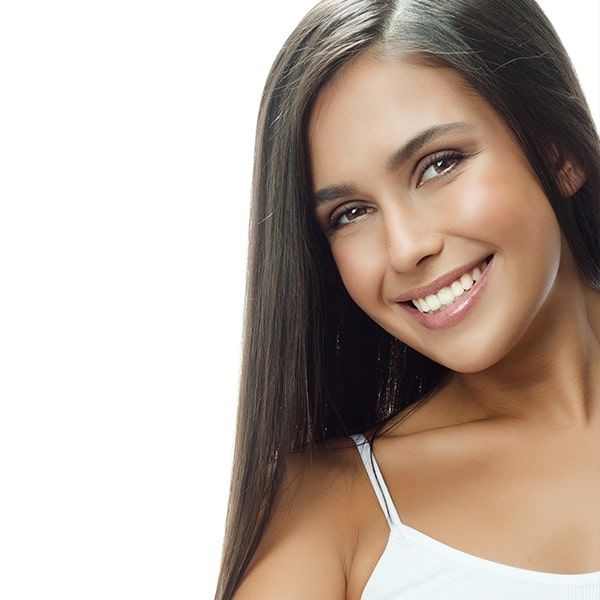 A young woman smiling after teeth whitening